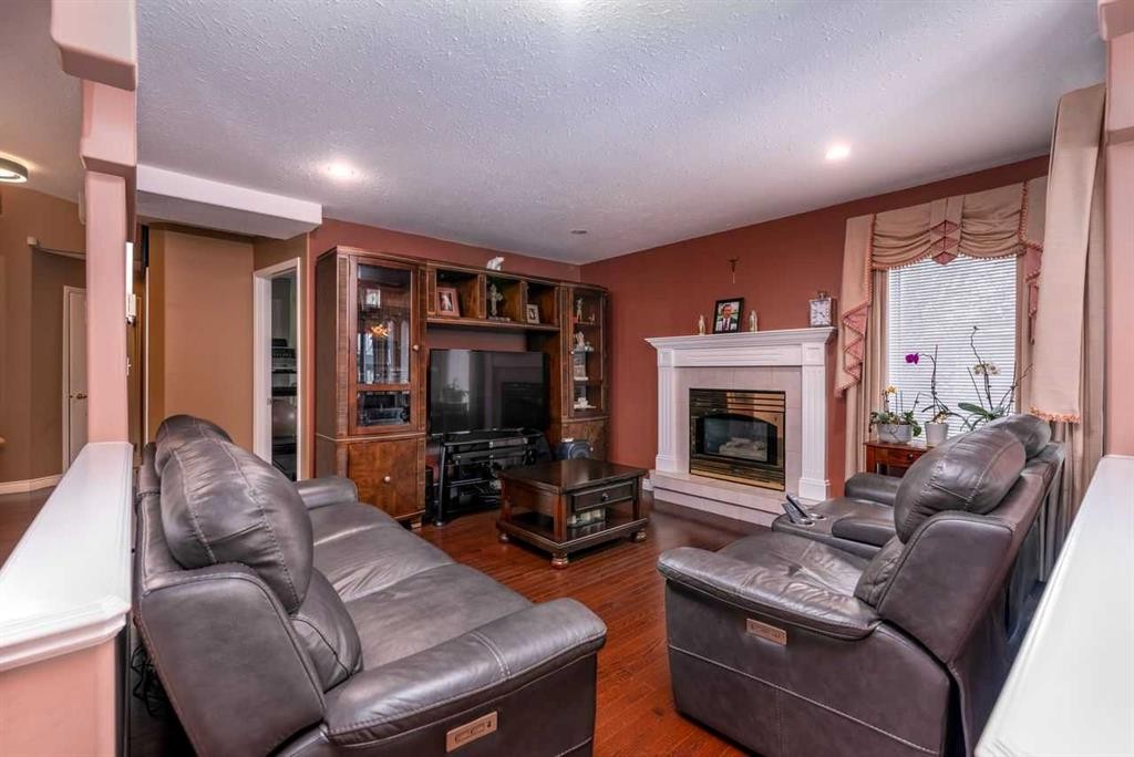 4002 60 Avenue, Lloydminster, AB - Indoor Photo Showing Living Room With Fireplace
