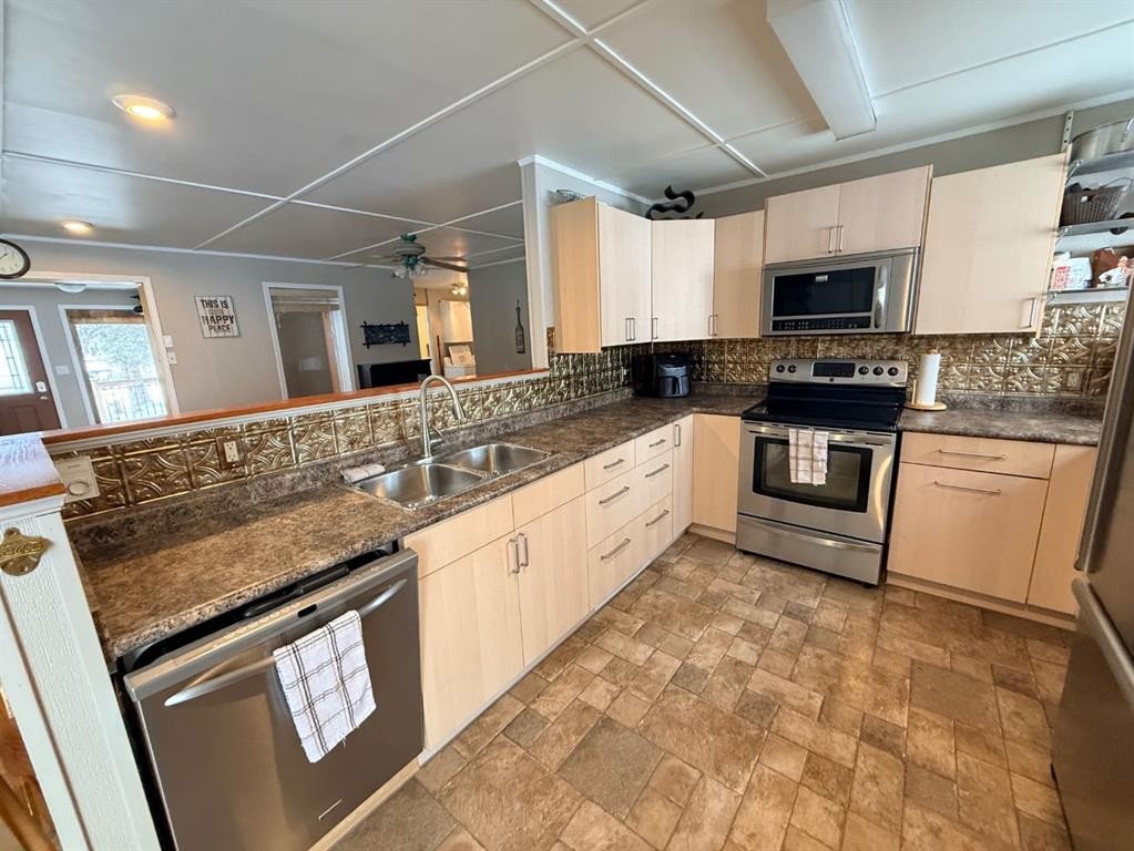 1313 Kewatin, Turtle Lake, SK - Indoor Photo Showing Kitchen With Stainless Steel Kitchen With Double Sink