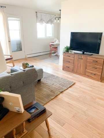 1-8-4504 56A Avenue, Lloydminster, AB - Indoor Photo Showing Living Room