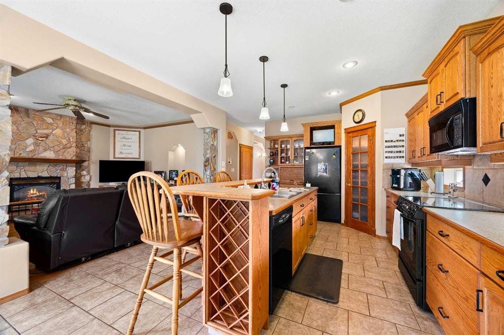 2204 59A Avenue Close, Lloydminster, AB - Indoor Photo Showing Kitchen With Fireplace