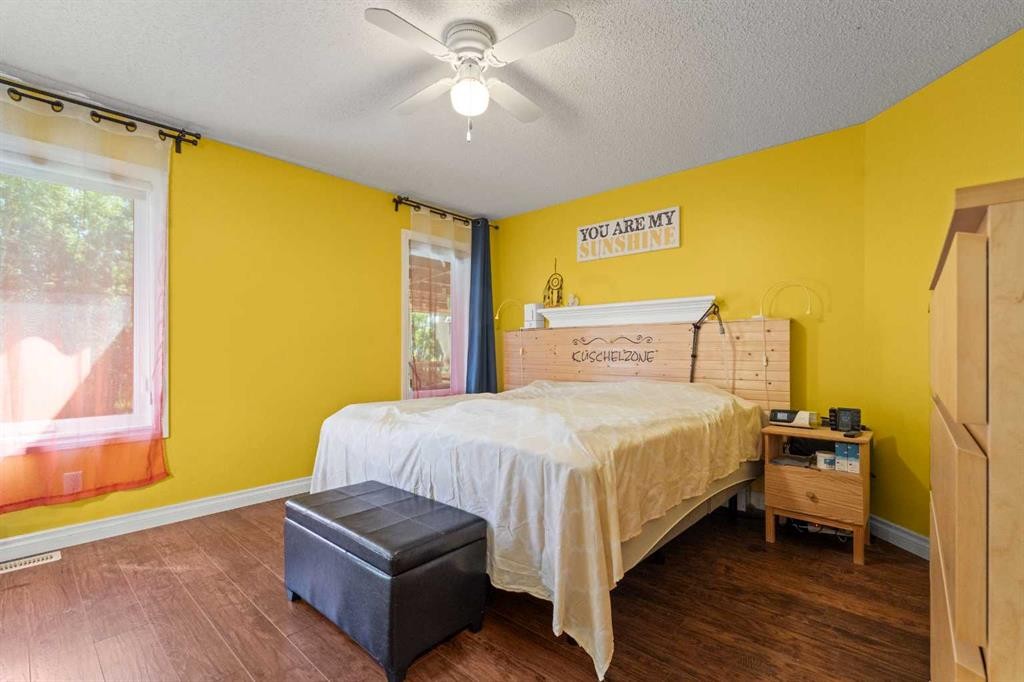 115 Dunham Lane, Diamond Valley, AB - Indoor Photo Showing Bedroom