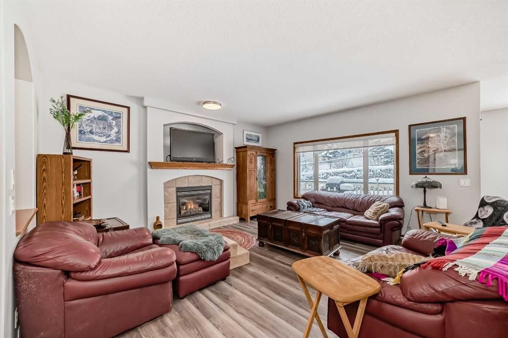 13 Bow Ridge Drive, Cochrane, AB - Indoor Photo Showing Living Room With Fireplace