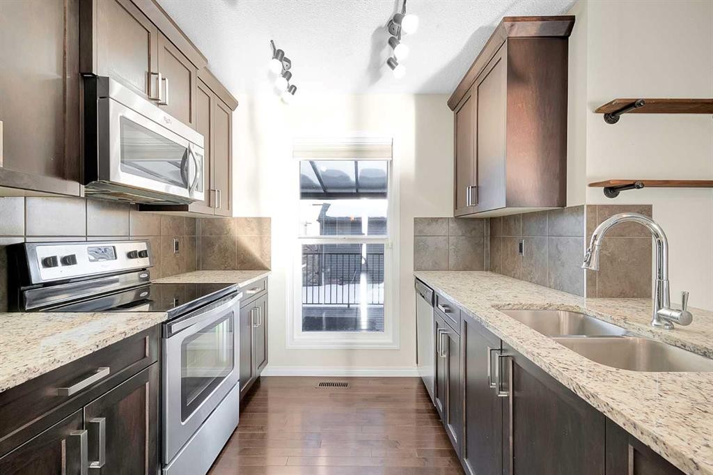 149 Walden Parade Se, Calgary, AB - Indoor Photo Showing Kitchen With Double Sink With Upgraded Kitchen