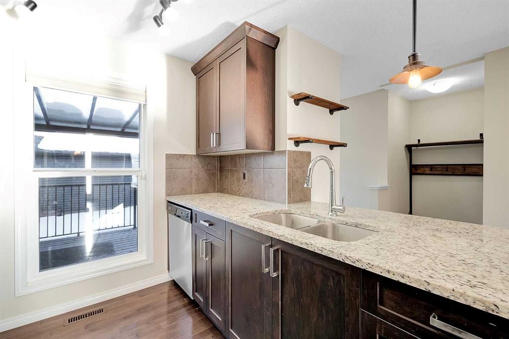 149 Walden Parade Se, Calgary, AB - Indoor Photo Showing Kitchen With Double Sink