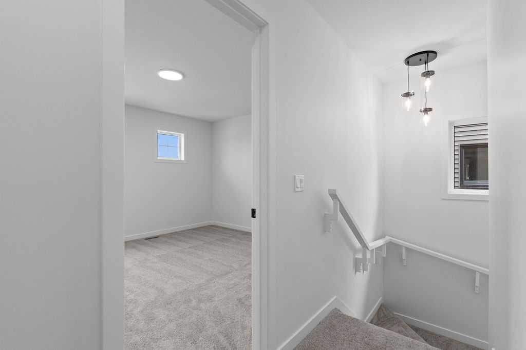 1029 Reynolds Crescent Sw, Airdrie, AB - Indoor Photo Showing Other Room