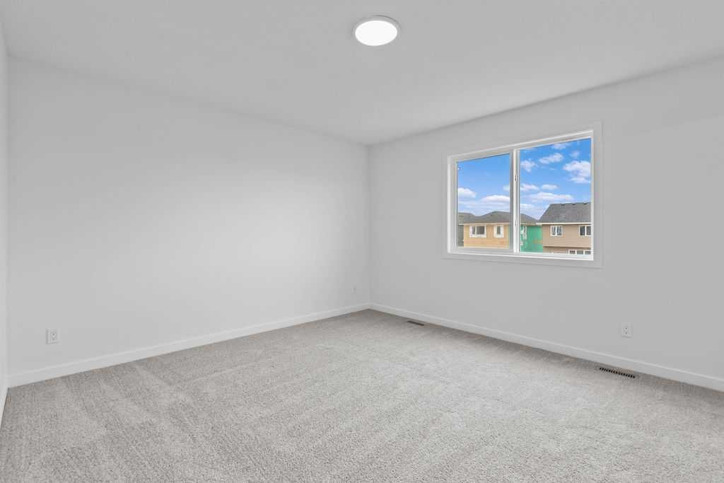 1029 Reynolds Crescent Sw, Airdrie, AB - Indoor Photo Showing Other Room