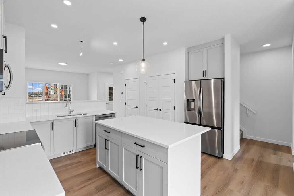 1029 Reynolds Crescent Sw, Airdrie, AB - Indoor Photo Showing Kitchen With Stainless Steel Kitchen With Upgraded Kitchen