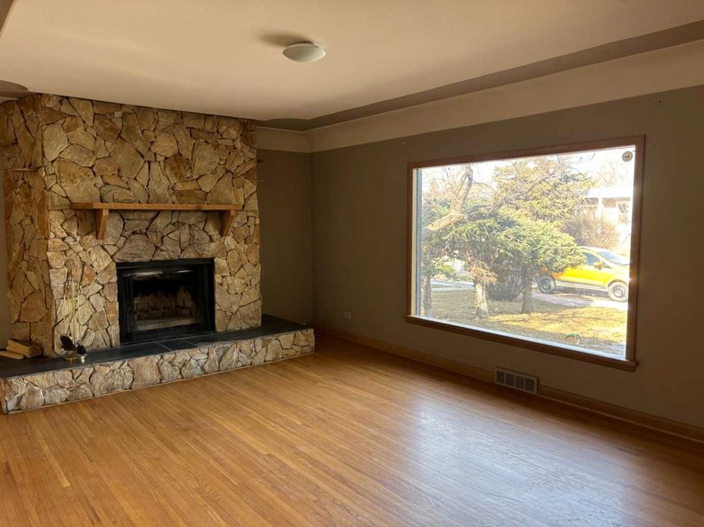 2111 Halifax Crescent Nw, Calgary, AB - Indoor Photo Showing Living Room With Fireplace