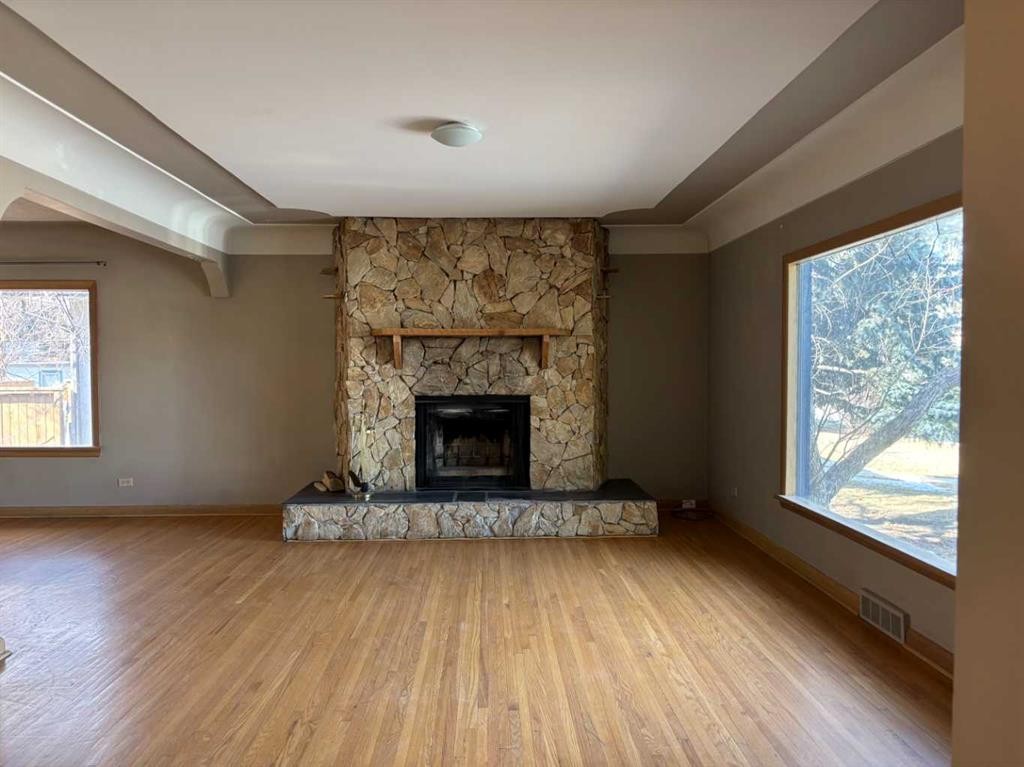 2111 Halifax Crescent Nw, Calgary, AB - Indoor Photo Showing Living Room With Fireplace