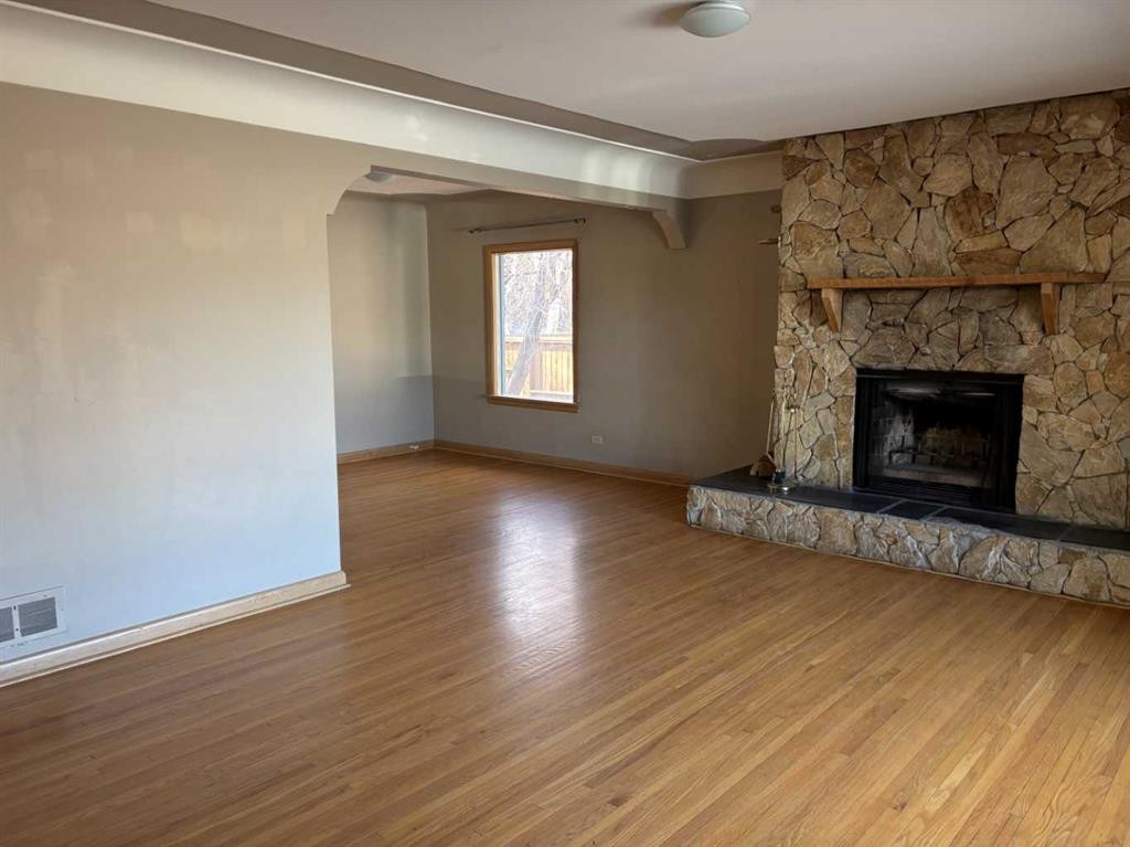 2111 Halifax Crescent Nw, Calgary, AB - Indoor Photo Showing Living Room With Fireplace