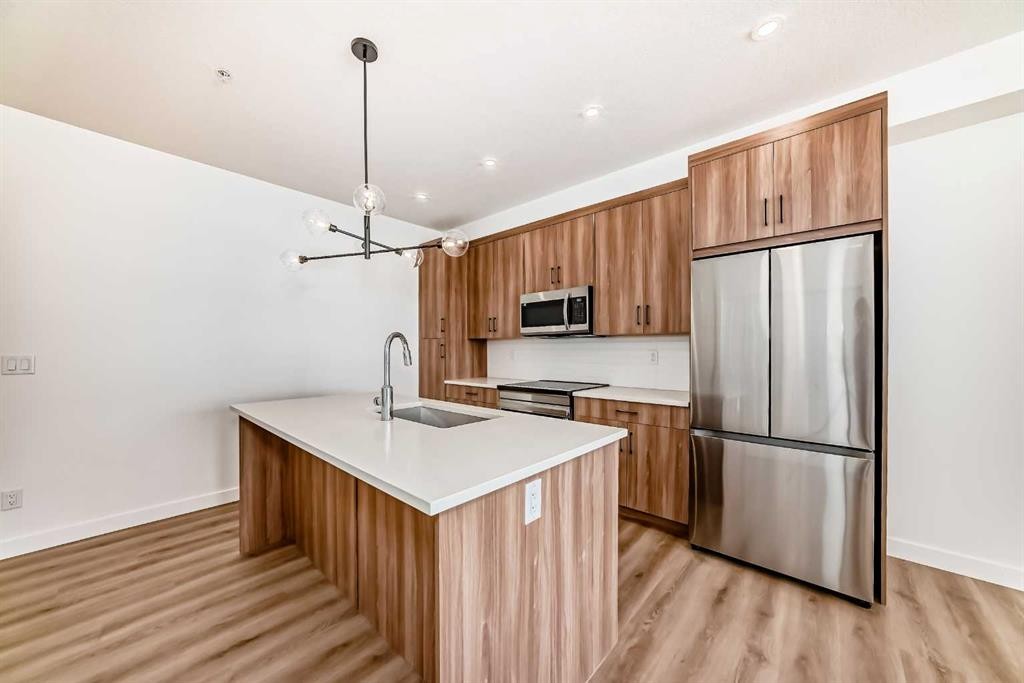 8202-1802 Mahogany Boulevard Se, Calgary, AB - Indoor Photo Showing Kitchen With Stainless Steel Kitchen