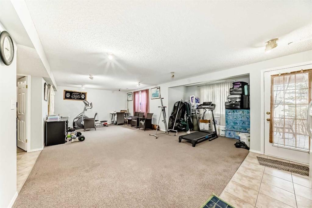 158 Panamount Drive Nw, Calgary, AB - Indoor Photo Showing Gym Room