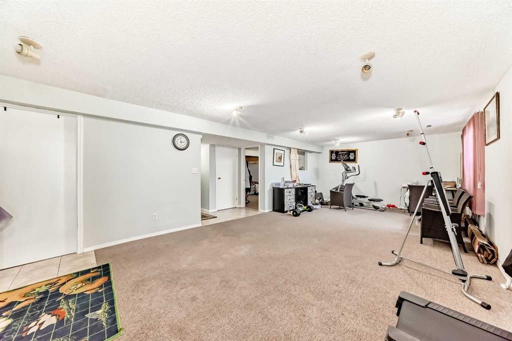158 Panamount Drive Nw, Calgary, AB - Indoor Photo Showing Gym Room