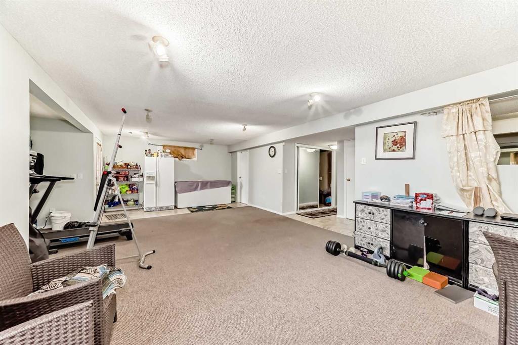 158 Panamount Drive Nw, Calgary, AB - Indoor Photo Showing Gym Room