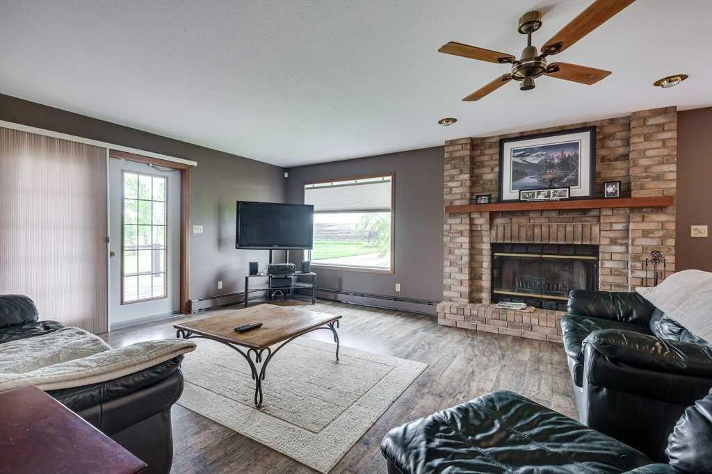 331039-Rge. Rd.242, Rural Kneehill County, AB - Indoor Photo Showing Living Room With Fireplace