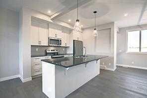109 Cobblestone Gate Sw, Airdrie, AB - Indoor Photo Showing Kitchen With Upgraded Kitchen