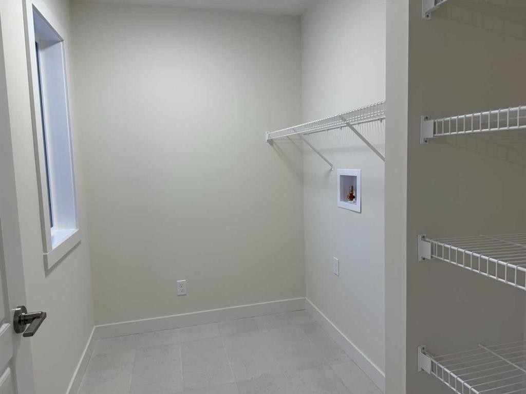 92 Sundown Crescent, Cochrane, AB - Indoor With Storage