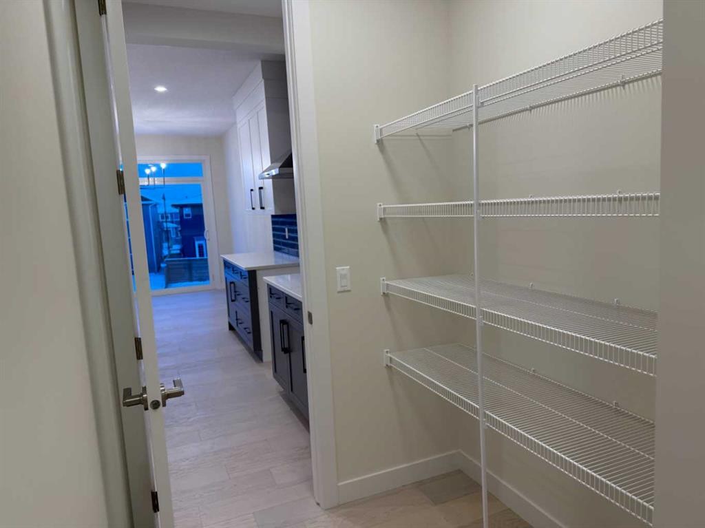 92 Sundown Crescent, Cochrane, AB - Indoor With Storage