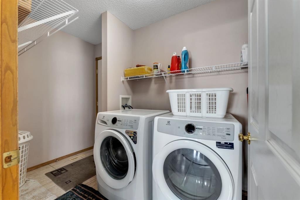 717 Coral Springs Boulevard Ne, Calgary, AB - Indoor Photo Showing Laundry Room
