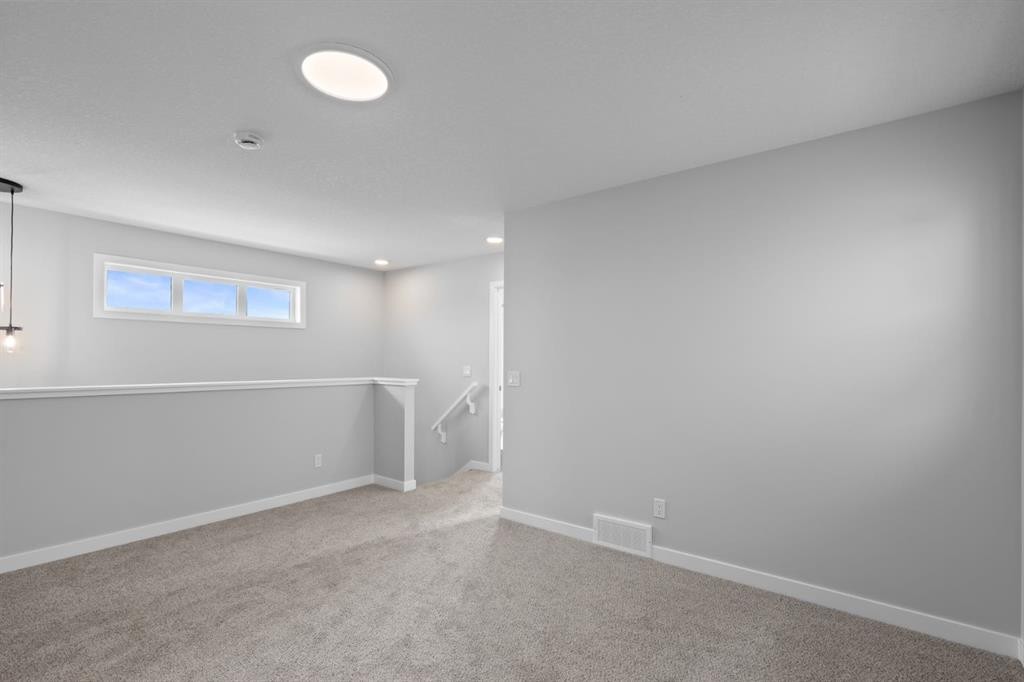 114 Lewiston Way Ne, Calgary, AB - Indoor Photo Showing Other Room
