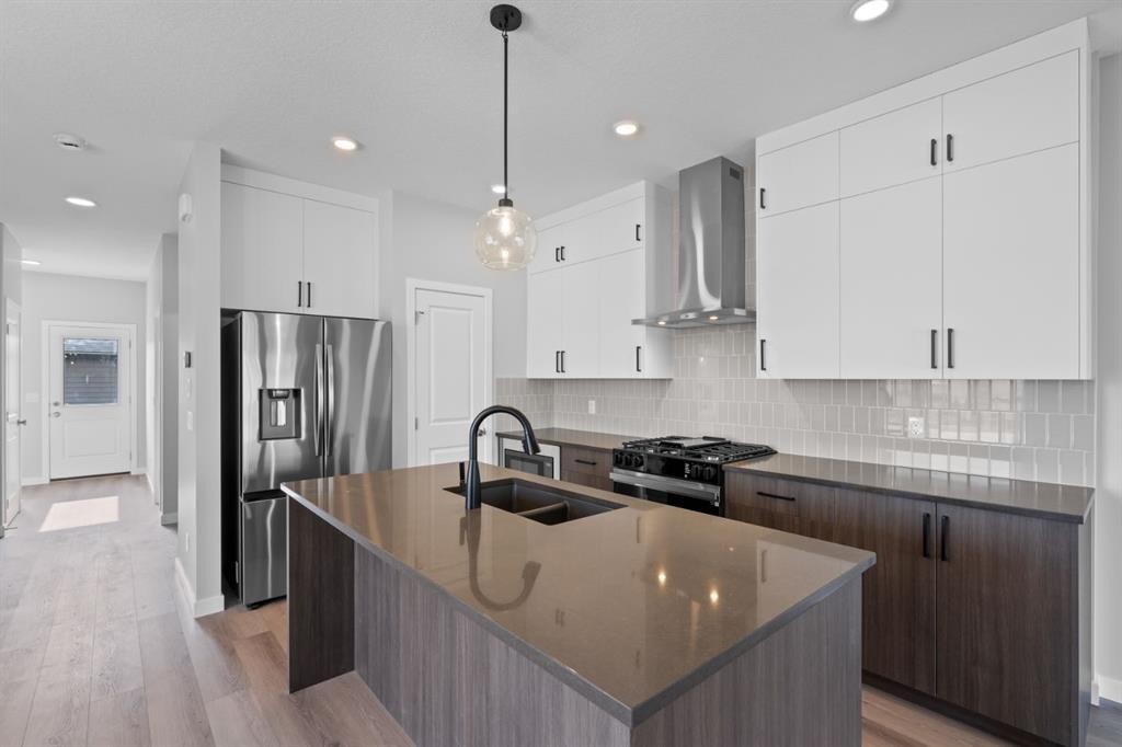 114 Lewiston Way Ne, Calgary, AB - Indoor Photo Showing Kitchen With Double Sink With Upgraded Kitchen