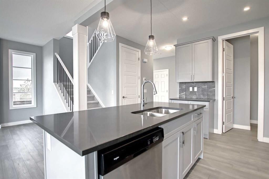 47 Agate Road, Cochrane, AB - Indoor Photo Showing Kitchen With Double Sink With Upgraded Kitchen