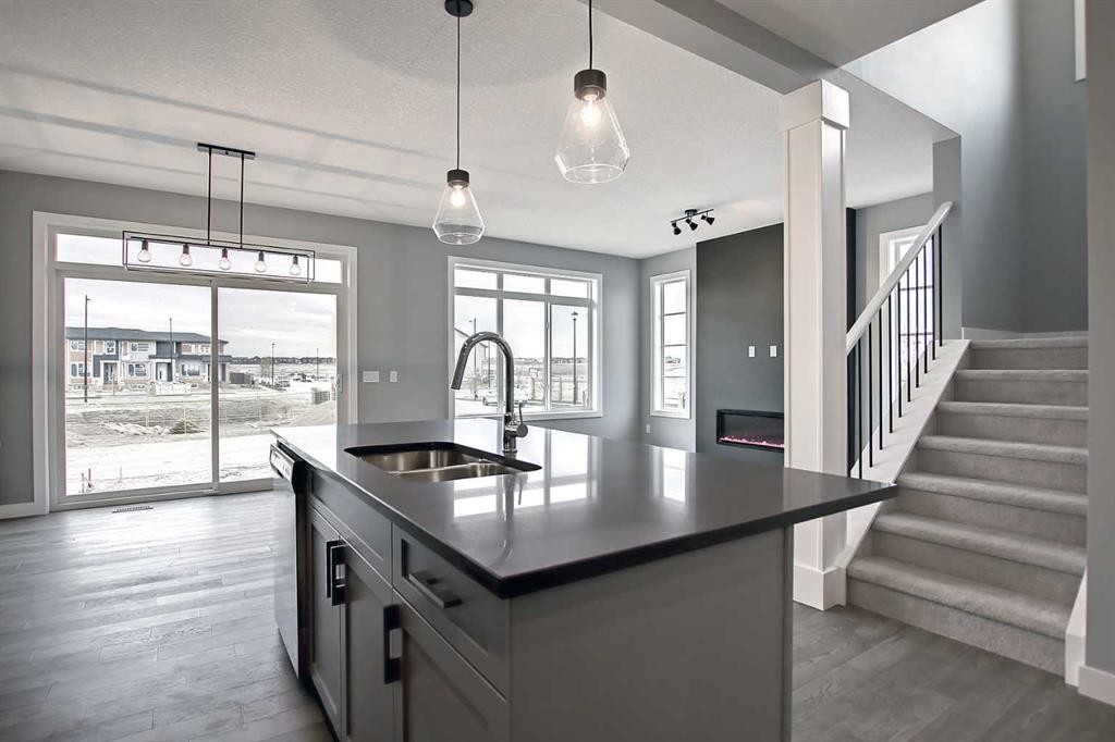 47 Agate Road, Cochrane, AB - Indoor Photo Showing Kitchen With Double Sink With Upgraded Kitchen