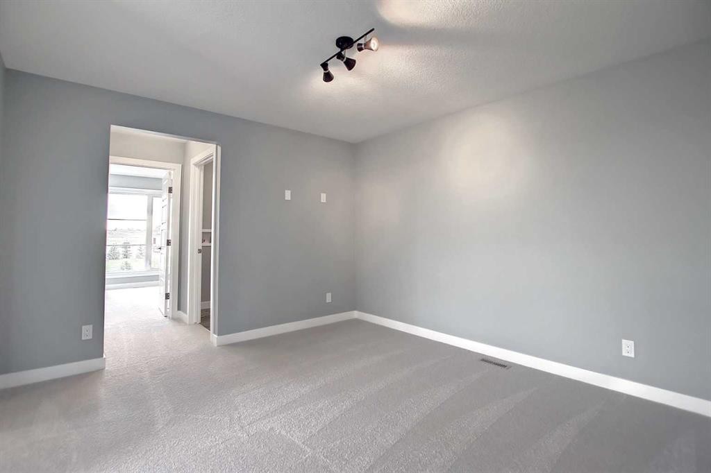 47 Agate Road, Cochrane, AB - Indoor Photo Showing Other Room