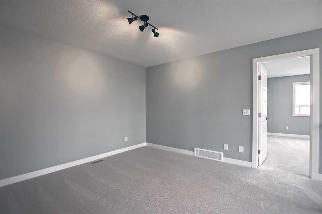 47 Agate Road, Cochrane, AB - Indoor Photo Showing Other Room