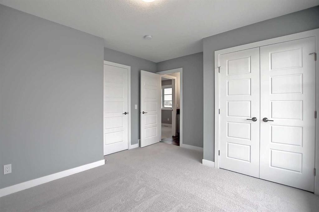 47 Agate Road, Cochrane, AB - Indoor Photo Showing Other Room