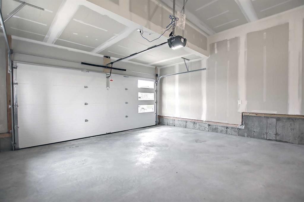 47 Agate Road, Cochrane, AB - Indoor Photo Showing Garage