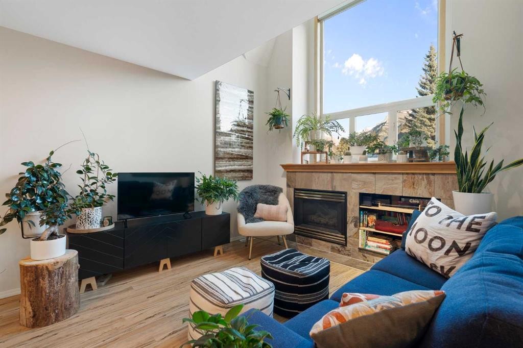 2-601 4Th Street, Canmore, AB - Indoor Photo Showing Living Room With Fireplace