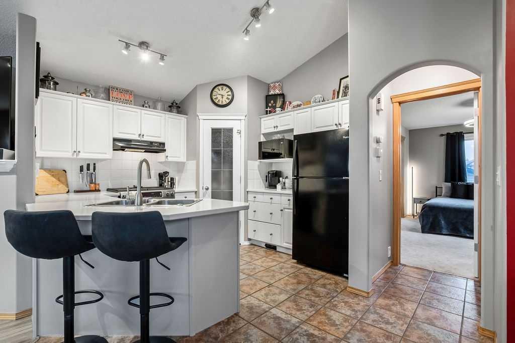 128 Cramond Crescent Se, Calgary, AB - Indoor Photo Showing Kitchen With Double Sink
