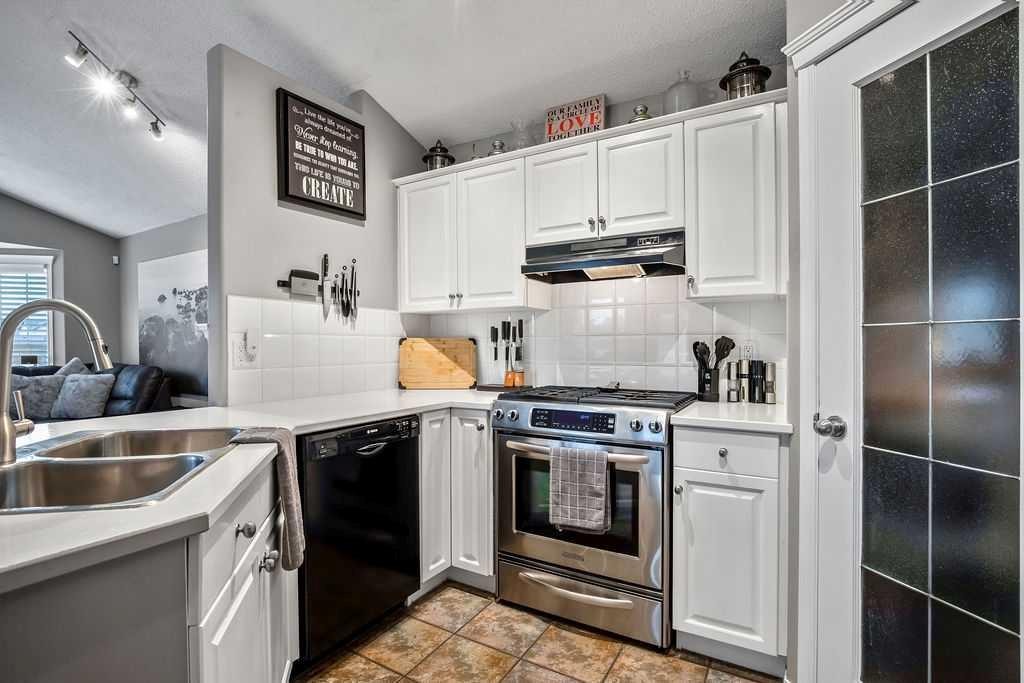 128 Cramond Crescent Se, Calgary, AB - Indoor Photo Showing Kitchen With Double Sink