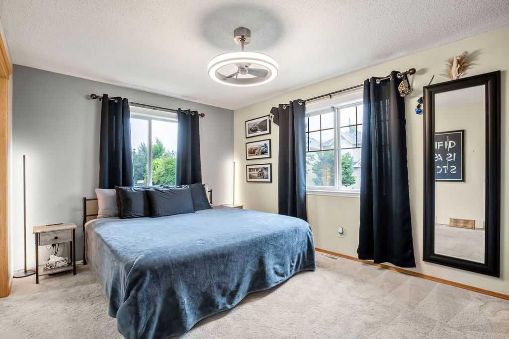 128 Cramond Crescent Se, Calgary, AB - Indoor Photo Showing Bedroom