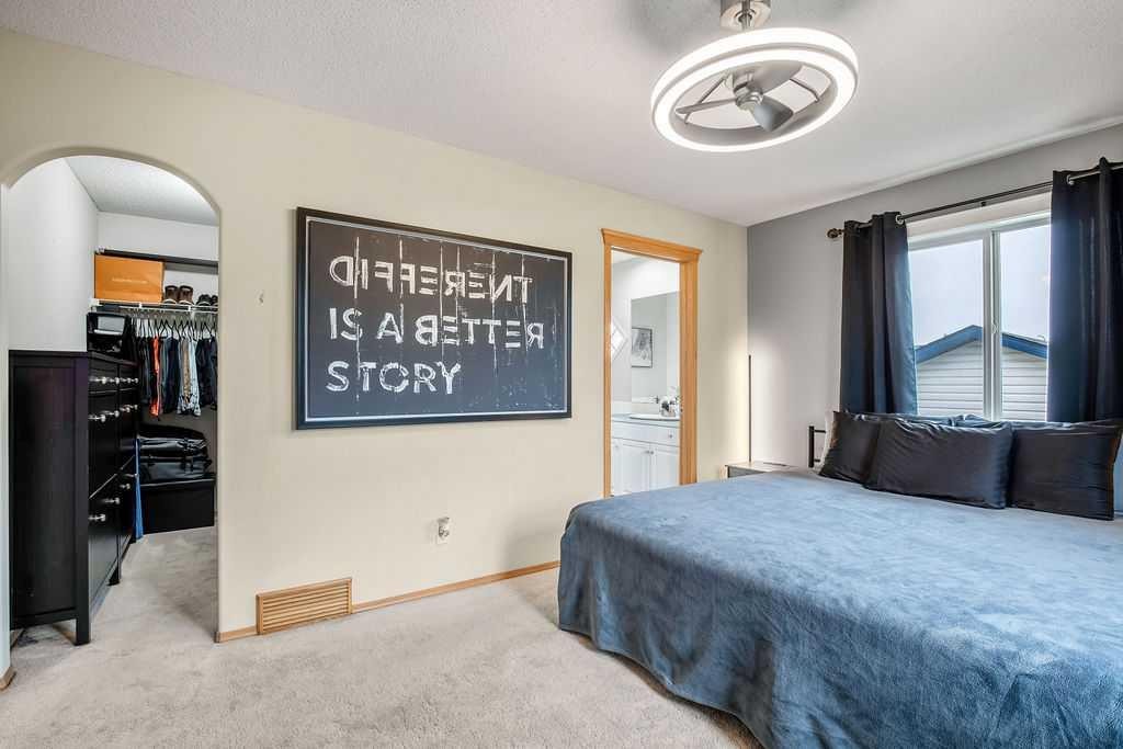 128 Cramond Crescent Se, Calgary, AB - Indoor Photo Showing Bedroom