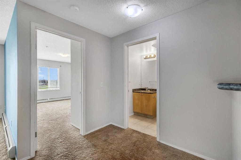 6307-304 Mackenzie Way Sw, Airdrie, AB - Indoor Photo Showing Other Room