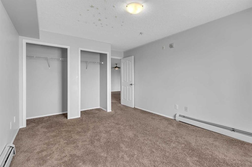6307-304 Mackenzie Way Sw, Airdrie, AB - Indoor Photo Showing Other Room