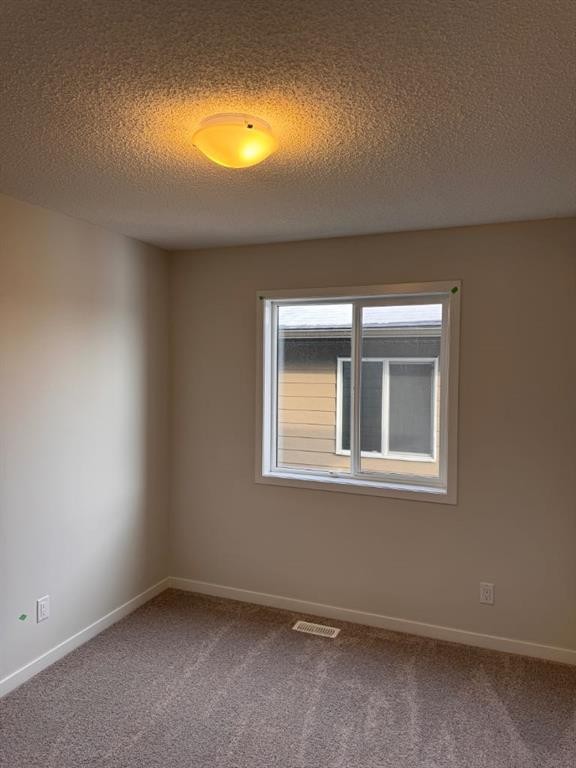 25 Setonvista Gate Se, Calgary, AB - Indoor Photo Showing Other Room