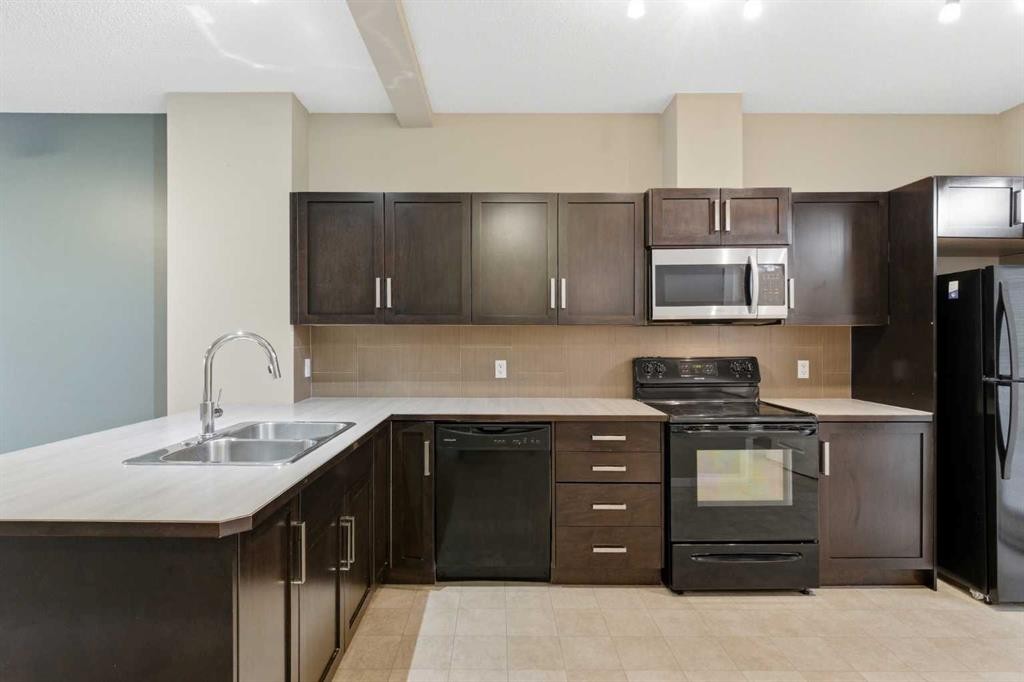 172 New Brighton Point Se, Calgary, AB - Indoor Photo Showing Kitchen With Double Sink
