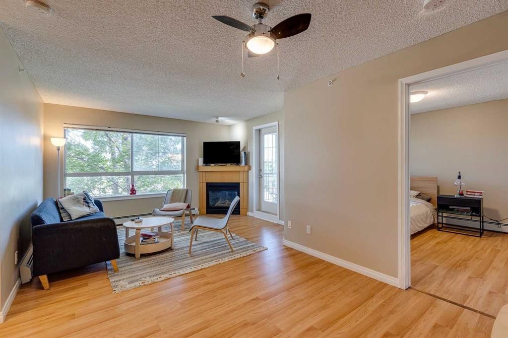 329-22 Richard Place Sw, Calgary, AB - Indoor Photo Showing Living Room With Fireplace