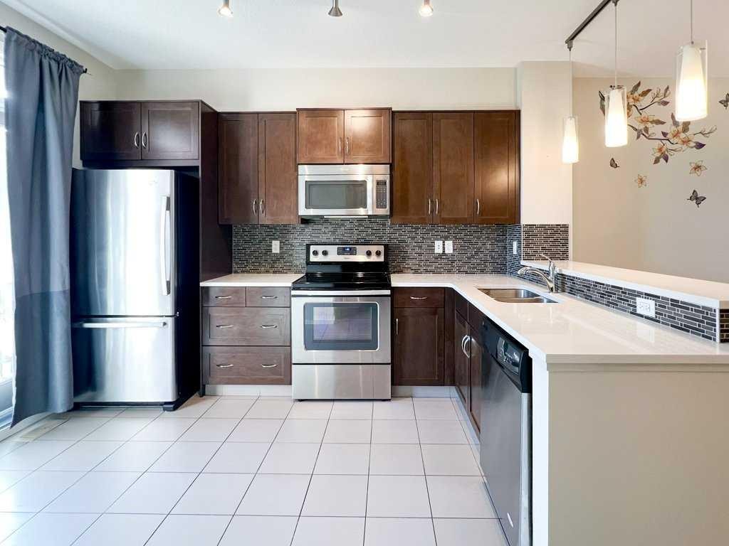 28 Kinlea Common Nw, Calgary, AB - Indoor Photo Showing Kitchen With Double Sink