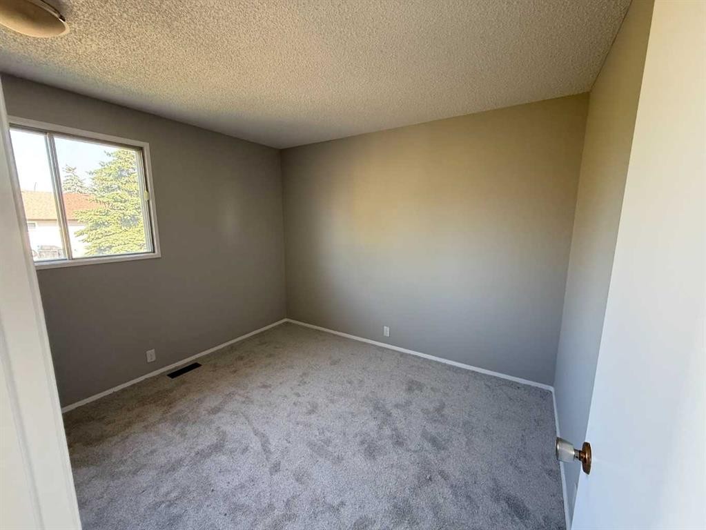 74 Aberdare Way Ne, Calgary, AB - Indoor Photo Showing Other Room