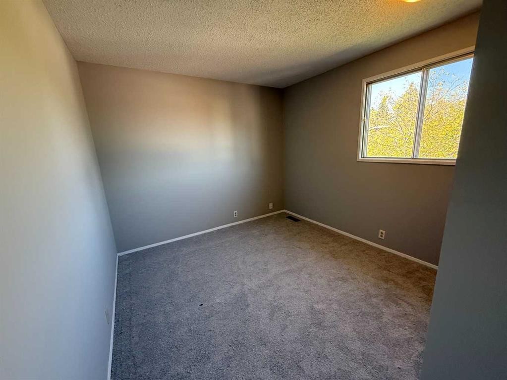 74 Aberdare Way Ne, Calgary, AB - Indoor Photo Showing Other Room