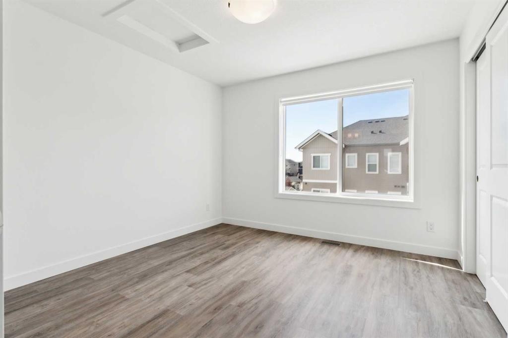 703-24 Rivercrest Drive, Cochrane, AB - Indoor Photo Showing Other Room