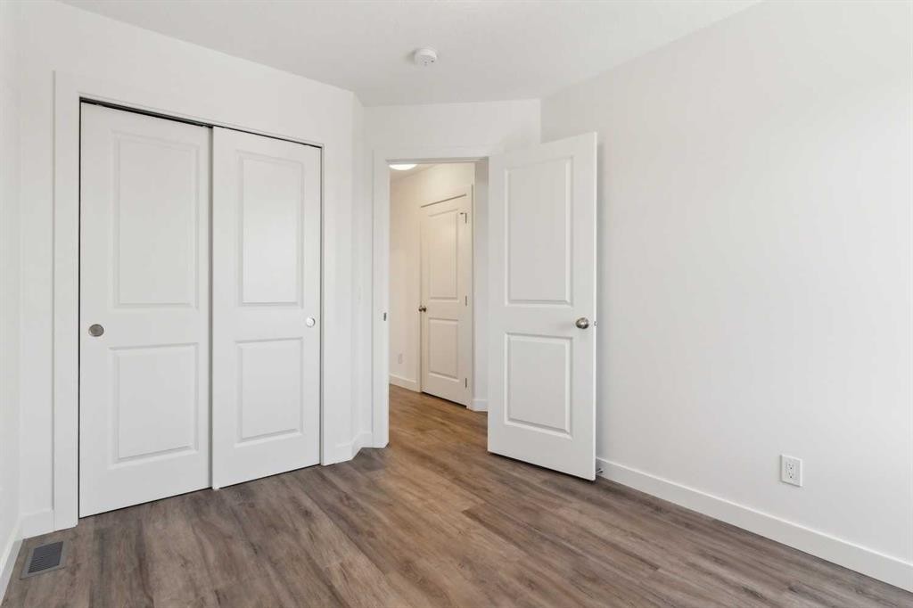 703-24 Rivercrest Drive, Cochrane, AB - Indoor Photo Showing Other Room