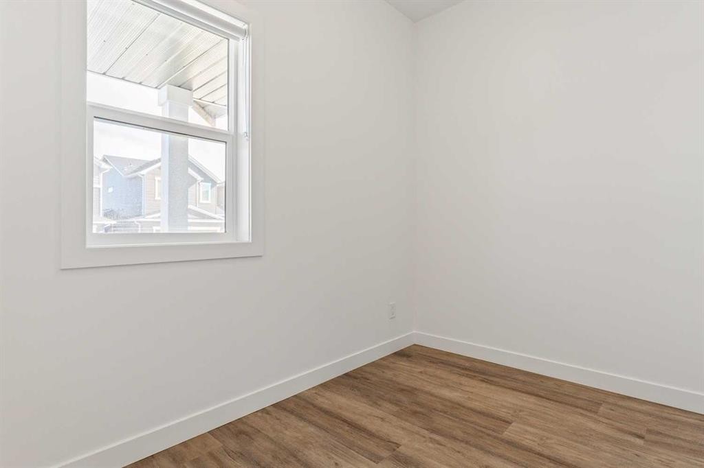 703-24 Rivercrest Drive, Cochrane, AB - Indoor Photo Showing Other Room