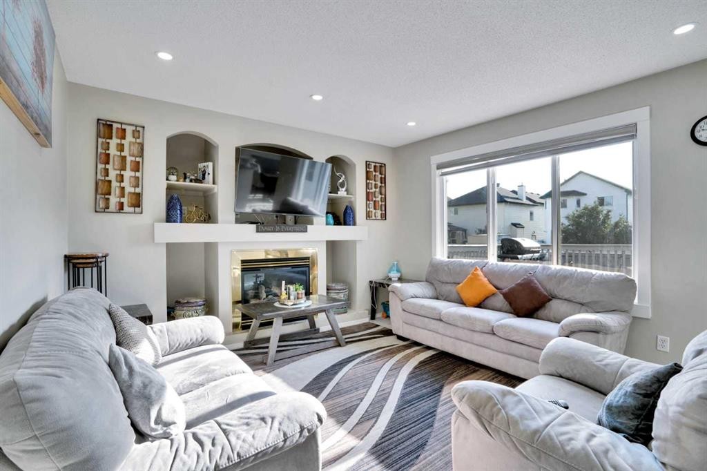 140 Saddlehorn Crescent Ne, Calgary, AB - Indoor Photo Showing Living Room With Fireplace
