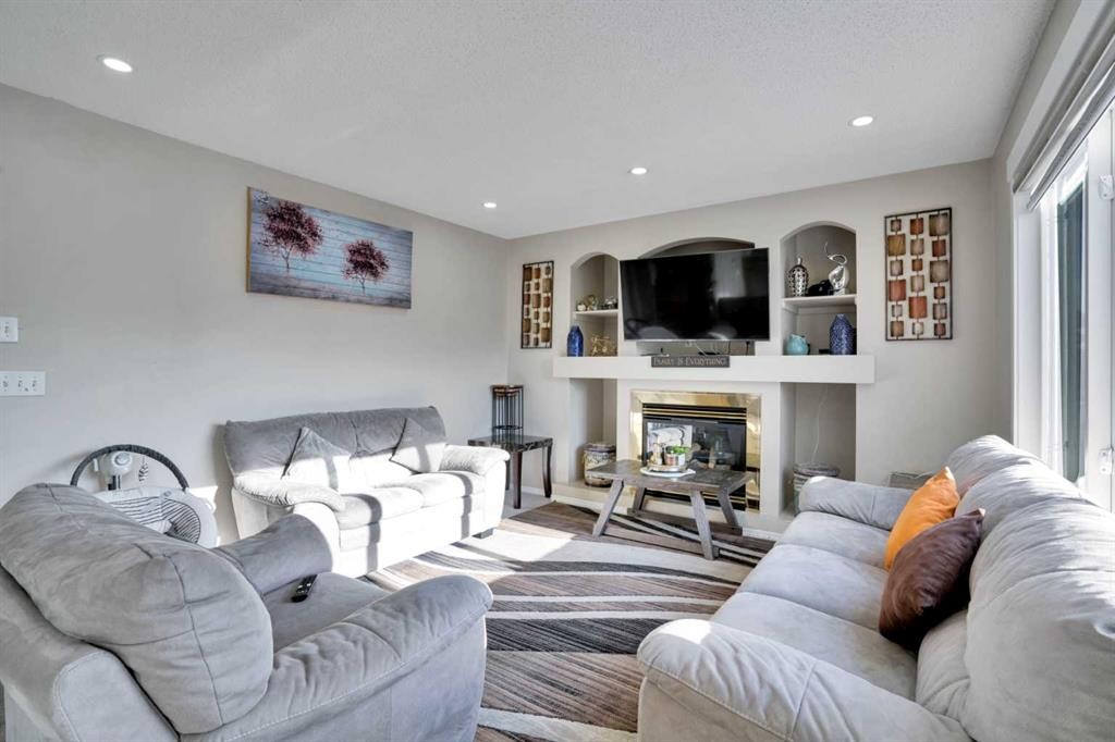 140 Saddlehorn Crescent Ne, Calgary, AB - Indoor Photo Showing Living Room With Fireplace