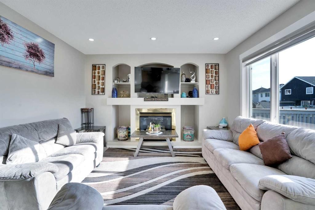 140 Saddlehorn Crescent Ne, Calgary, AB - Indoor Photo Showing Living Room With Fireplace